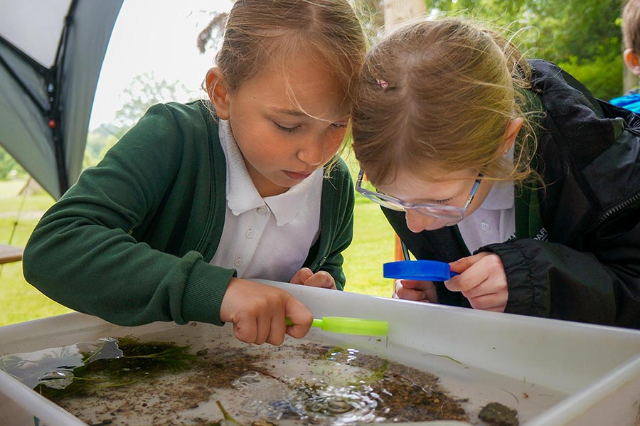 Two school girls learning about nature at Englefield Schools Day 2026