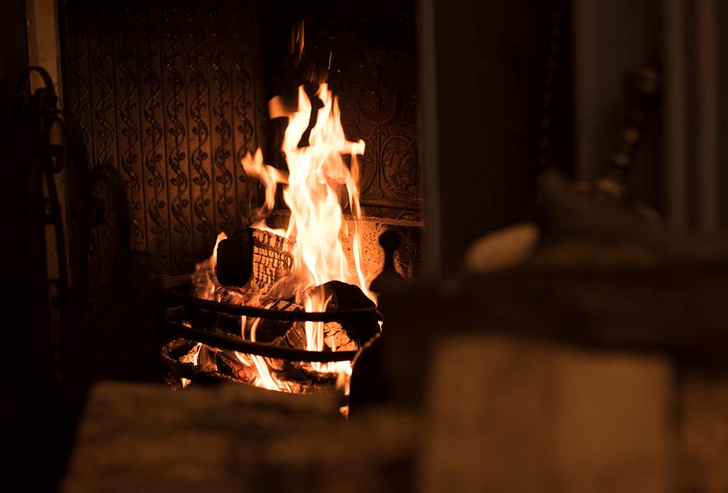 Fire roaring in The Dining Room at Englefield Estate