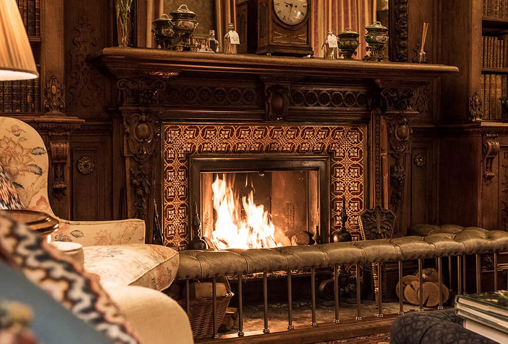 The fireplace in The Library at Englefield Estate
