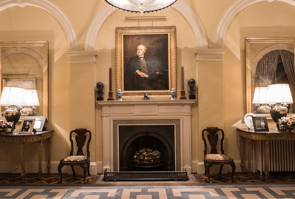 Painting above fireplace in Ground Floor Hall at Englefield Estate